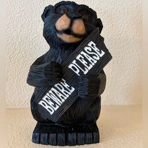 Black Bear Figurine with Non-Removable Sign. Resin. ~10” x 6” x 6”. No flaws.